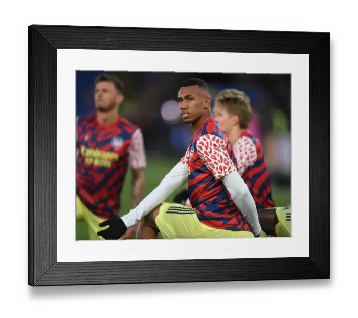 Framed Print : Gabriel Magalhaes Gears Up: Arsenal's Pre-Match Training Before Crystal Palace Clash in Premier League 2021-22