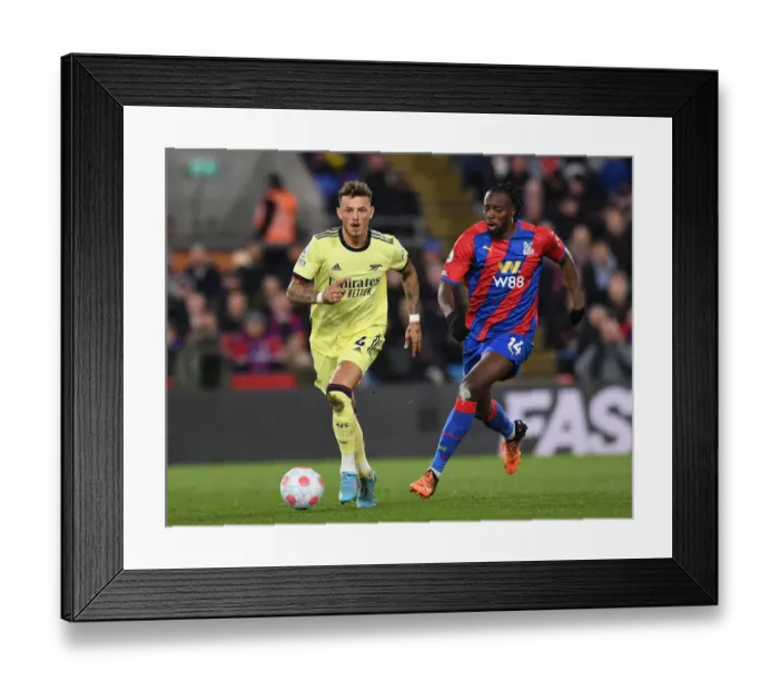 Framed Print : Arsenal's Ben White Faces Off Against Crystal Palace's Jean-Philippe Mateta in Premier League Clash