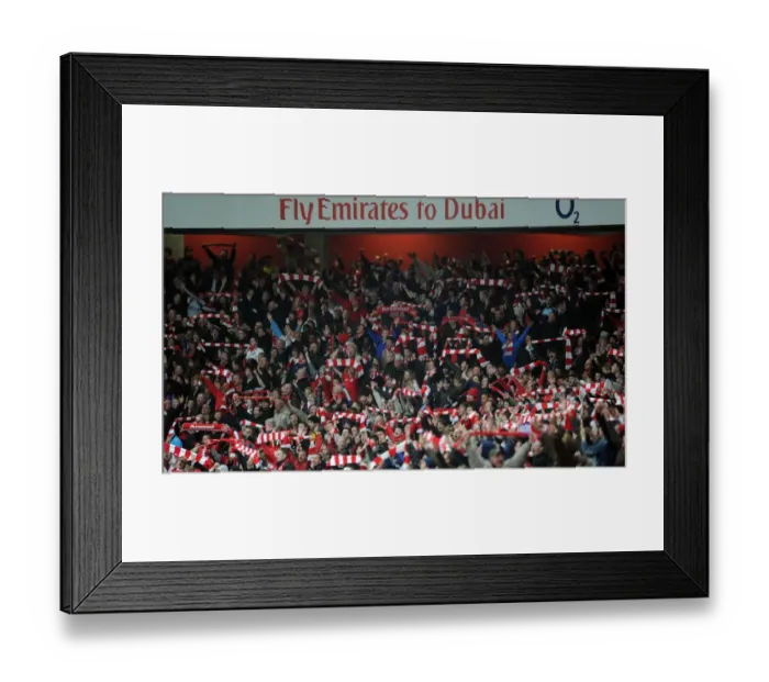 Framed Print : Arsenal fans celebrate the 2nd goal. Arsenal 2: 0 West Ham United, Barclays Premeir League