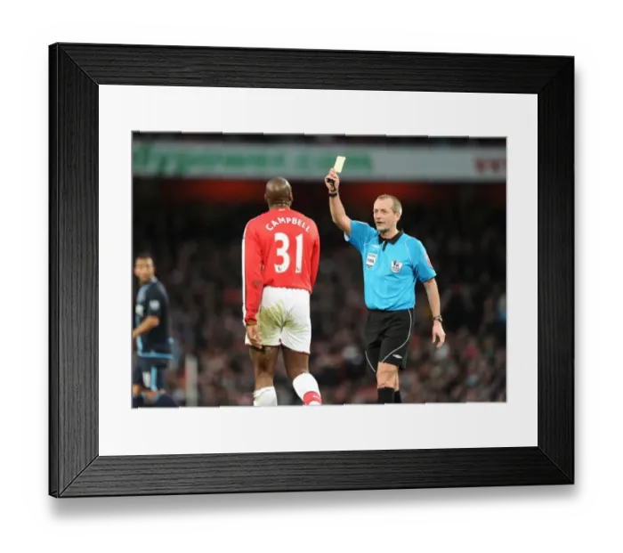 Framed Print : Arsenla defender Sol Campbell is shown the yellow card by referee Martin Atkinson Framed Print : Arsenla defender Sol Campbell is shown the yellow card by referee Martin Atkinson