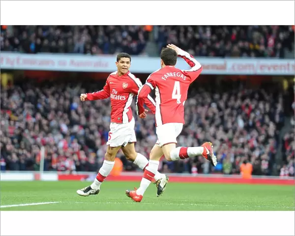 Denilson shoots celebrates scoring the 1st Arsenal goal with Cesc Fabregas