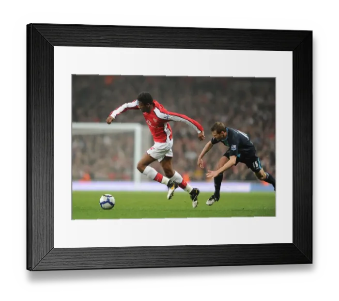 Framed Print : Abou Diaby (Arsenal) Jonathan Spector (West Ham). Arsenal 2: 0 West Ham United Framed Print : Abou Diaby (Arsenal) Jonathan Spector (West Ham). Arsenal 2: 0 West Ham United