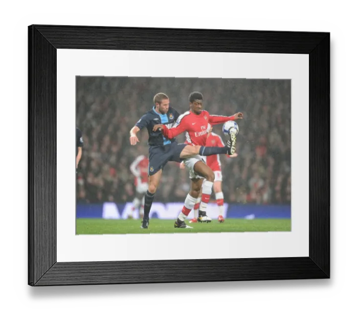 Framed Print : Abou Diaby (Arsenal) Matthew Upson (West Ham). Arsenal 2: 0 West Ham United Framed Print : Abou Diaby (Arsenal) Matthew Upson (West Ham). Arsenal 2: 0 West Ham United