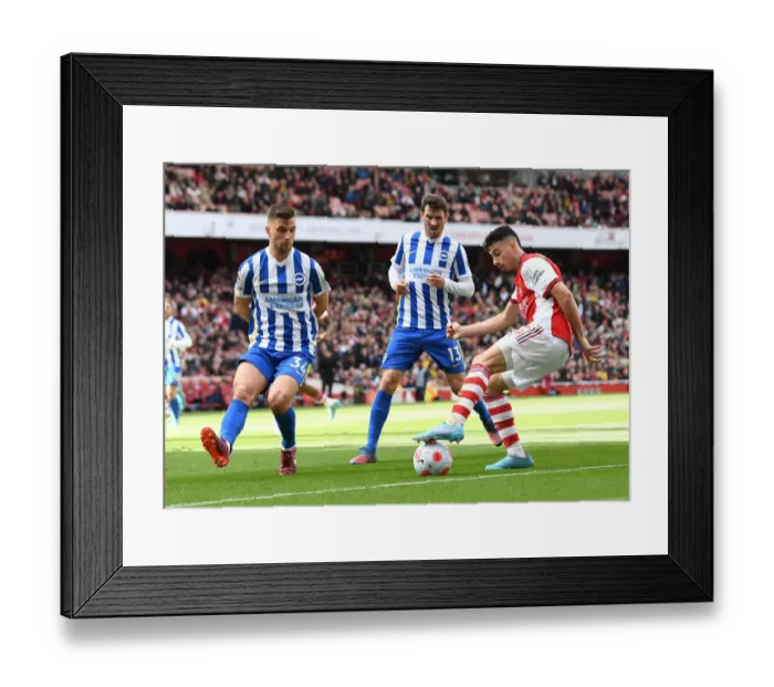 Framed Print : Martinelli Stands Firm Against Brighton Duo in Arsenal's Premier League Clash