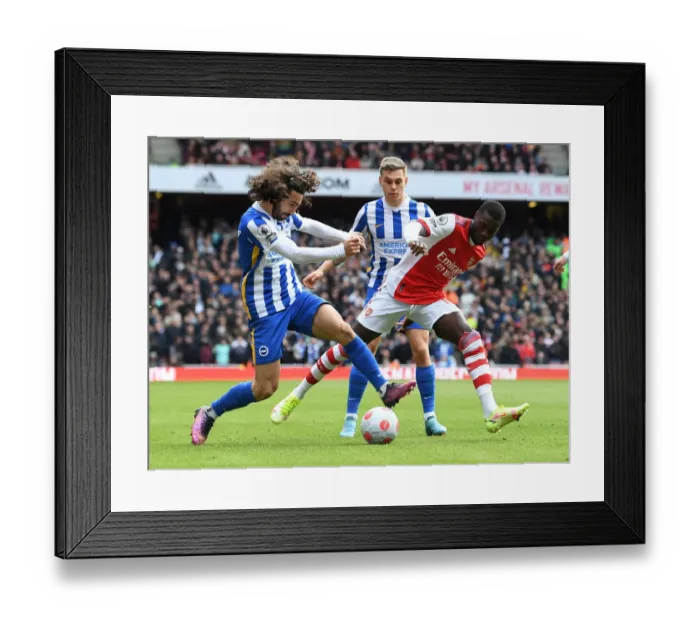 Framed Print : Pepe's Battle: Arsenal Star Goes Head-to-Head with Cucurella and Trossard in Intense Arsenal vs Brighton Clash (2021-22)