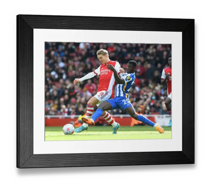 Framed Print : Odegaard vs Caicedo: Intense Rivalry in Arsenal vs Brighton Premier League Clash (April 2022)