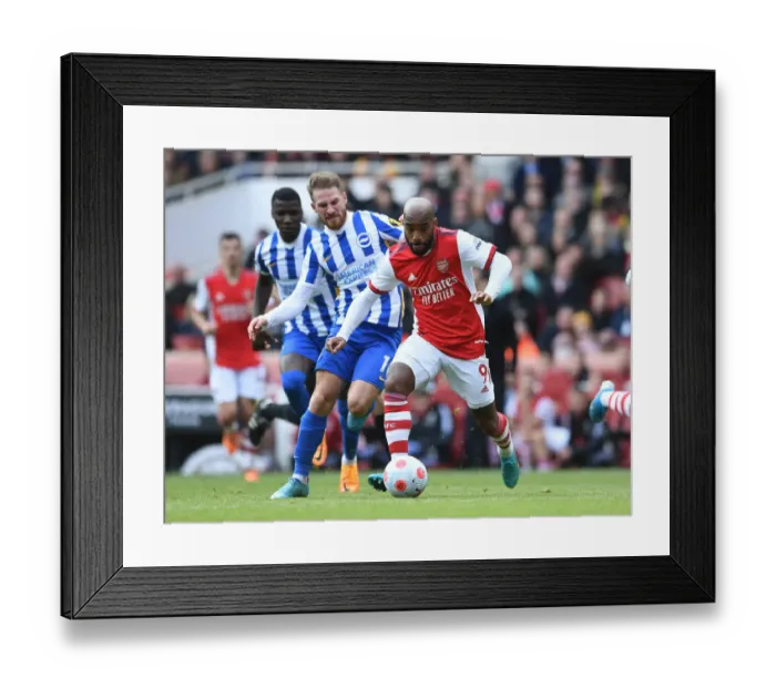 Framed Print : Lacazette vs. Mac Allister: A Premier League Showdown at the Emirates