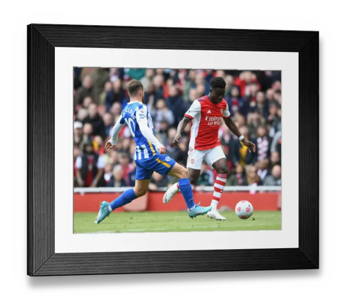 Framed Print : Saka vs Mac Allister: A Wings Showdown at Emirates Stadium
