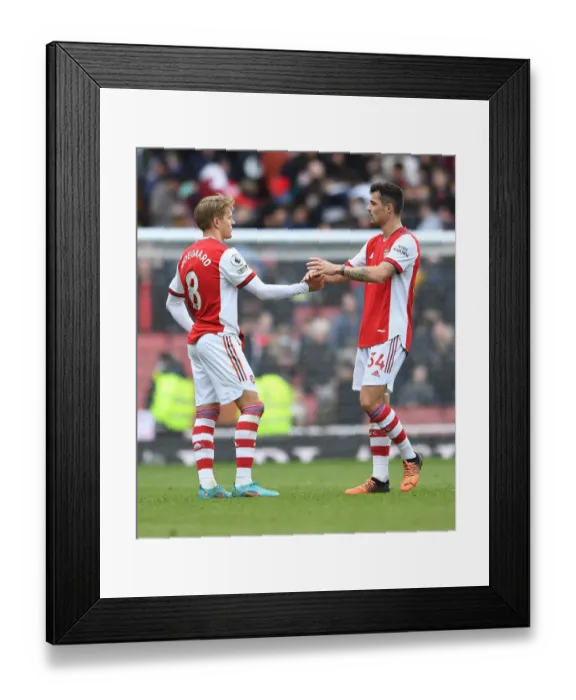 Framed Print : Arsenal's Martin Odegaard and Granit Xhaka Celebrate Victory Over Brighton & Hove Albion in Premier League