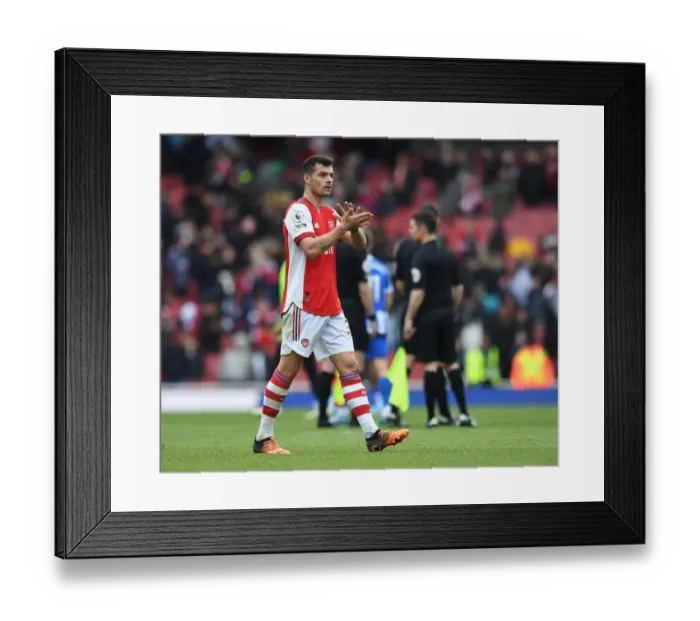Framed Print : Arsenal's Granit Xhaka Celebrates with Fans after Arsenal v Brighton & Hove Albion, Premier League 2021-22 Framed Print : Arsenal's Granit Xhaka Celebrates with Fans after Arsenal v Brighton & Hove Albion, Premier League 2021-22