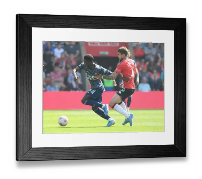 Framed Print : Arsenal's Eddie Nketiah Outmaneuvers Southampton's Lyanco in Premier League Clash Framed Print : Arsenal's Eddie Nketiah Outmaneuvers Southampton's Lyanco in Premier League Clash