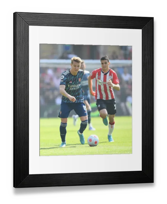 Framed Print : Martin Odegaard Breaks Past Elyounoussi: Southampton vs Arsenal, Premier League 2021-22 Framed Print : Martin Odegaard Breaks Past Elyounoussi: Southampton vs Arsenal, Premier League 2021-22