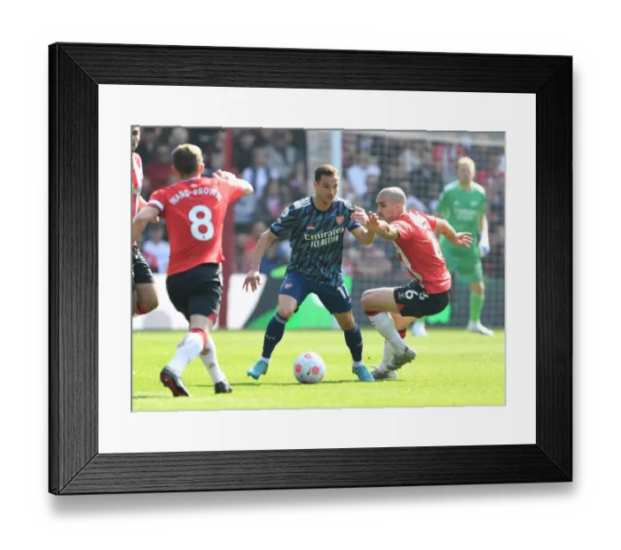 Framed Print : Clash at St. Mary's: Cedric vs. Romeu in Southampton vs. Arsenal Premier League Showdown