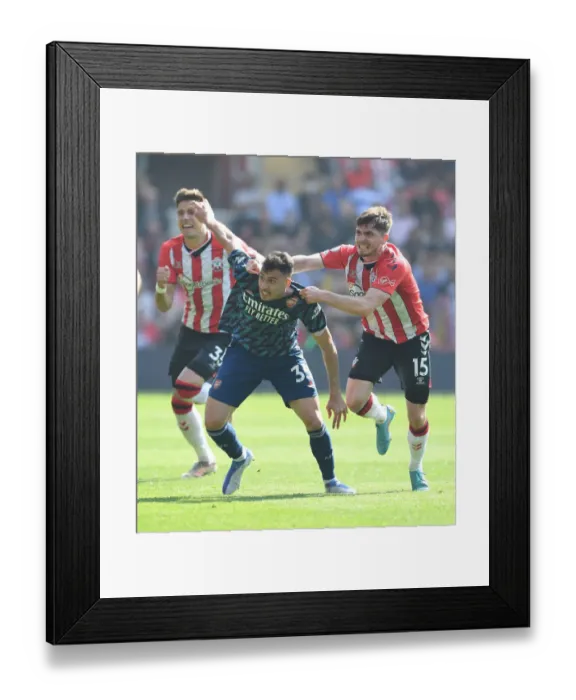 Framed Print : Martinelli vs Perraud: Clash at St. Mary's - Southampton vs Arsenal, Premier League 2021-22