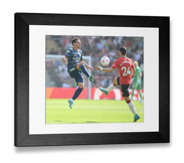 Framed Print : Clash at St. Mary's: Cedric vs. Elyounoussi in Southampton vs. Arsenal Premier League Showdown