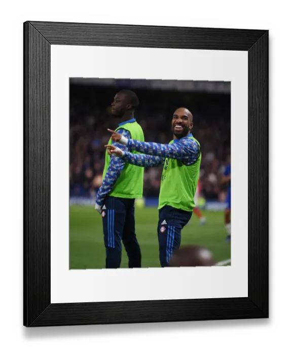 Framed Print : Alexis Lacazette's Light-Hearted Moment: Amidst the Intensity of Chelsea vs. Arsenal, Premier League 2021-22