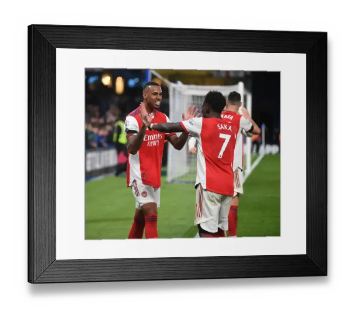 Framed Print : Arsenal's Four-Goal Rampage: Saka and Gabriel's Jubilant Moment at Stamford Bridge (April 2022)