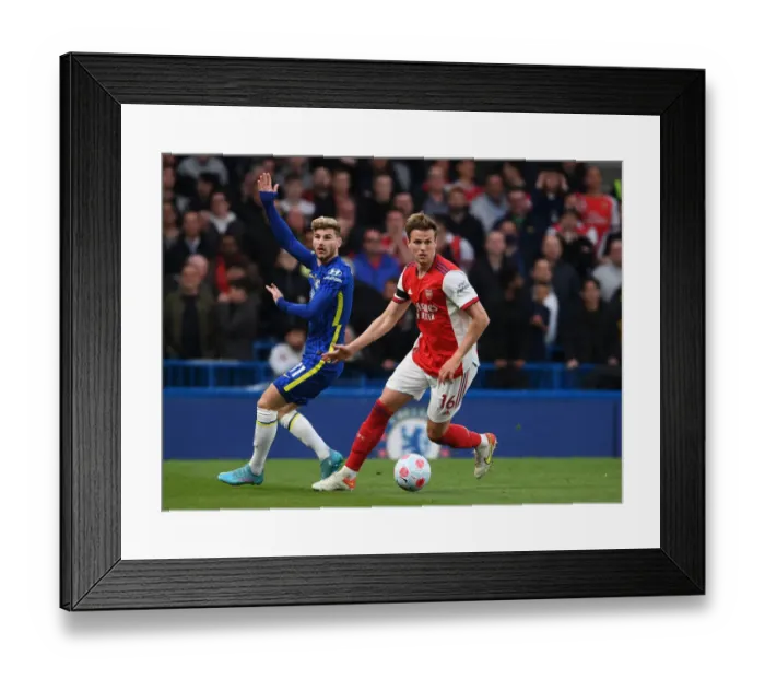 Framed Print : Clash at Stamford Bridge: Arsenal's Rob Holding Holds Off Chelsea's Timo Werner in Premier League Showdown