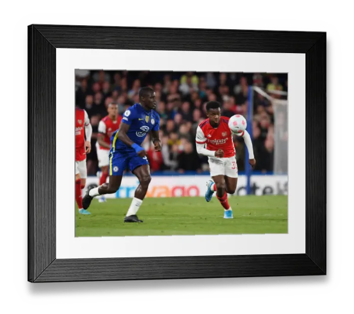 Framed Print : Arsenal's Eddie Nketiah Outmaneuvers Chelsea's Malang Sarr in Premier League Clash