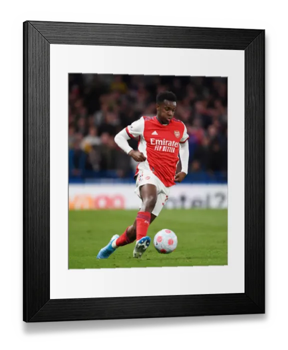 Framed Print : Arsenal's Eddie Nketiah Faces Off Against Chelsea at Stamford Bridge: A Premier League Battle, 2021-22 Framed Print : Arsenal's Eddie Nketiah Faces Off Against Chelsea at Stamford Bridge: A Premier League Battle, 2021-22