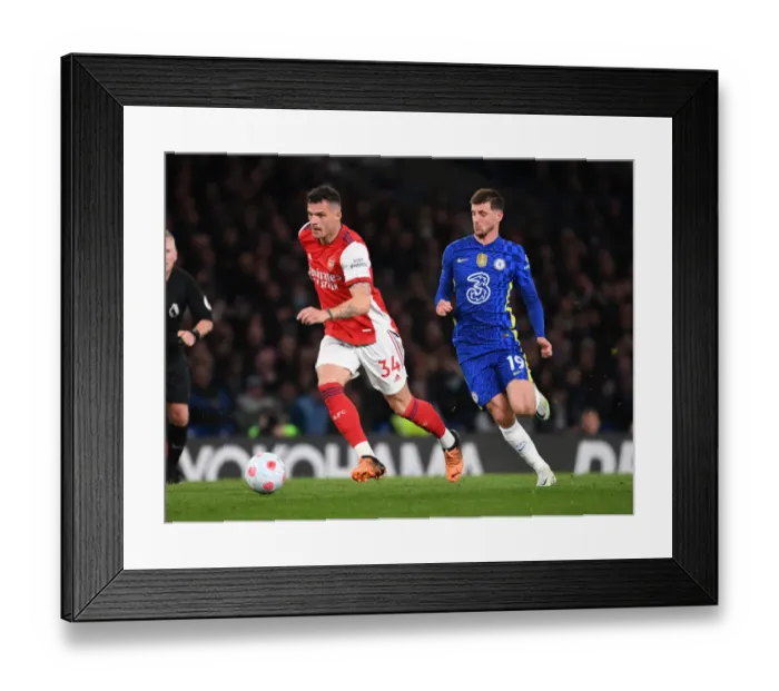 Framed Print : Granit Xhaka vs. Mason Mount: Intense Battle in Chelsea vs. Arsenal Premier League Clash