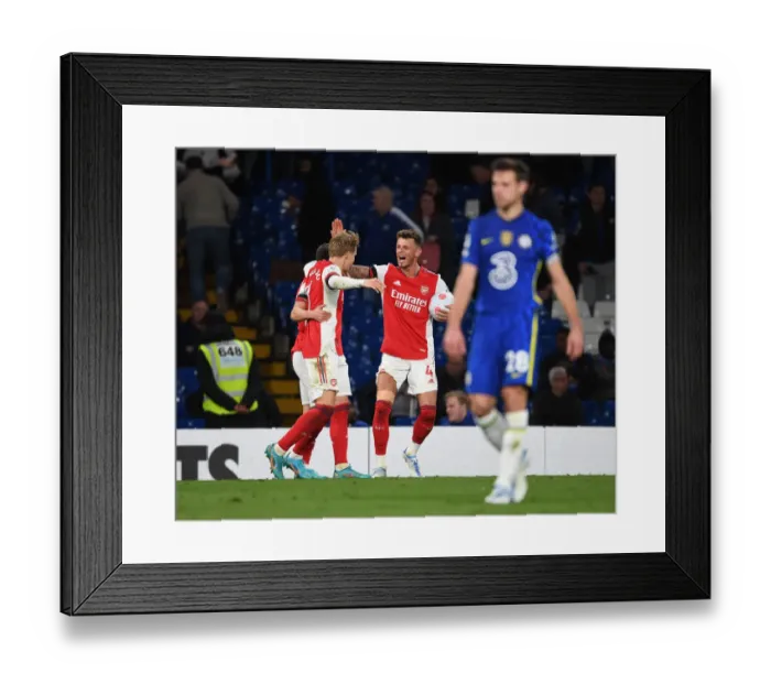 Framed Print : Arsenal's Victory: Odegaard and White's Triumphant Moment at Stamford Bridge Framed Print : Arsenal's Victory: Odegaard and White's Triumphant Moment at Stamford Bridge