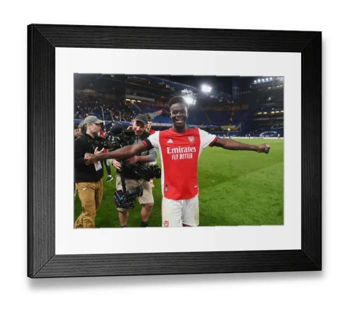 Framed Print : Bukayo Saka's Euphoric Celebration: Arsenal's Thrilling Victory over Chelsea in the Premier League (2021-22)