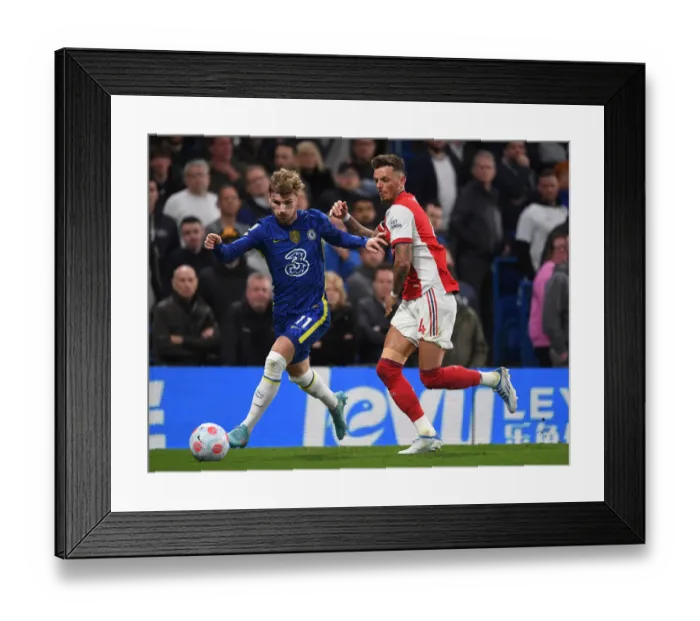 Framed Print : Clash at Stamford Bridge: Arsenal's Ben White Faces Off Against Chelsea's Timo Werner in Premier League Showdown