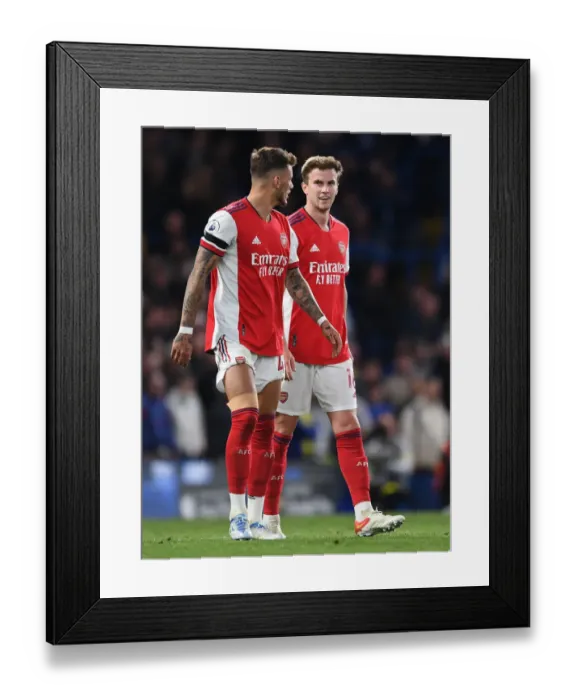 Framed Print : Arsenal's White and Holding Face Off Against Chelsea in Premier League Showdown Framed Print : Arsenal's White and Holding Face Off Against Chelsea in Premier League Showdown