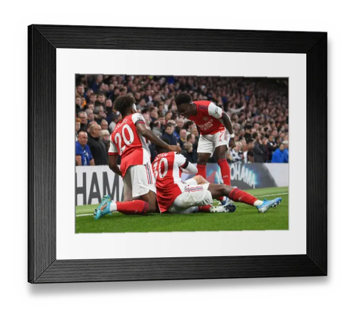 Framed Print : Jubilant Moment: Smith Rowe and Saka Celebrate Arsenal's Victory over Chelsea, Premier League 2021-22