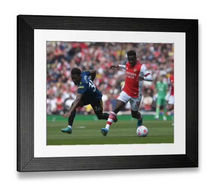 Framed Print : Arsenal vs Manchester United: Eddie Nketiah Clashes with Anthony Elanga in Intense Premier League Showdown Framed Print : Arsenal vs Manchester United: Eddie Nketiah Clashes with Anthony Elanga in Intense Premier League Showdown