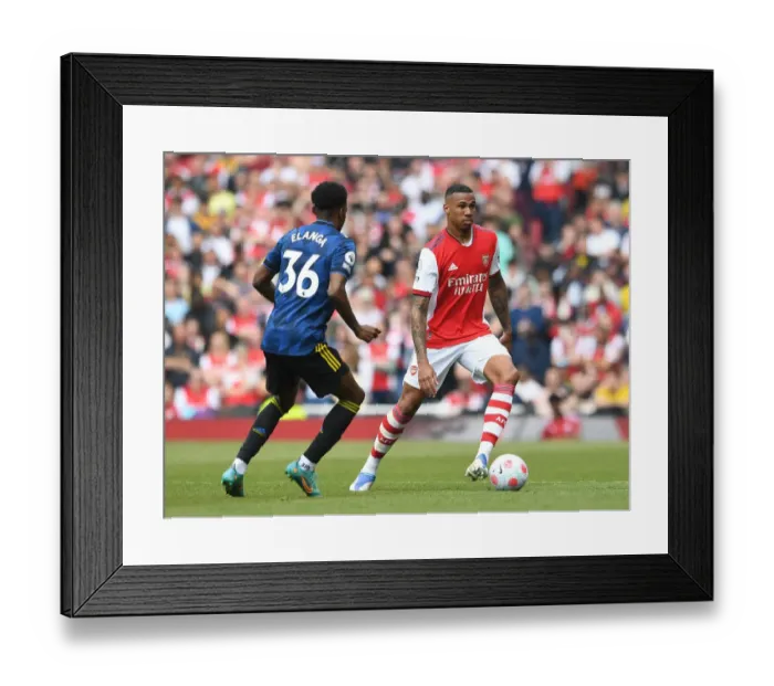 Framed Print : Arsenal's Martinelli Faces Off Against Manchester United in Premier League Showdown Framed Print : Arsenal's Martinelli Faces Off Against Manchester United in Premier League Showdown