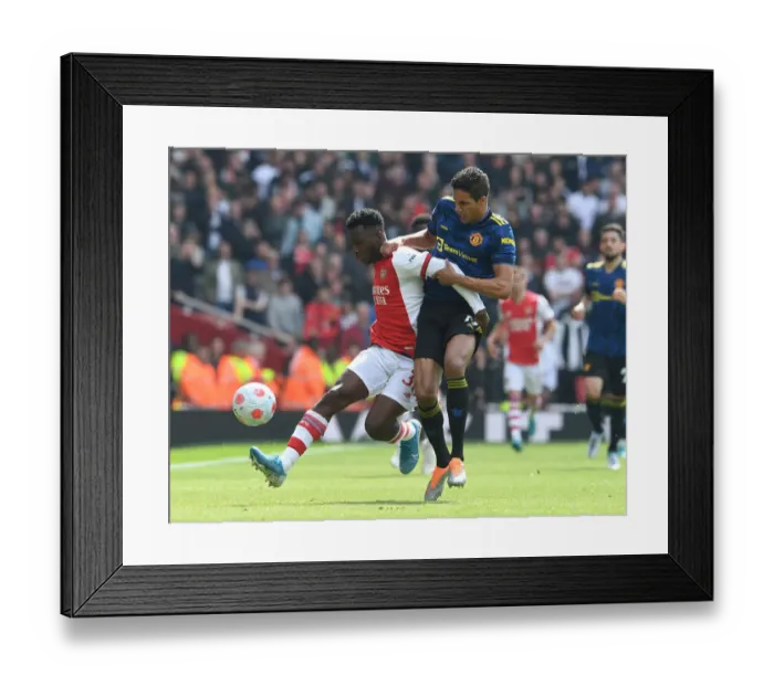 Framed Print : Nketiah vs Varane: Battle at the Emirates - Arsenal vs Manchester United, Premier League 2021-22 Framed Print : Nketiah vs Varane: Battle at the Emirates - Arsenal vs Manchester United, Premier League 2021-22