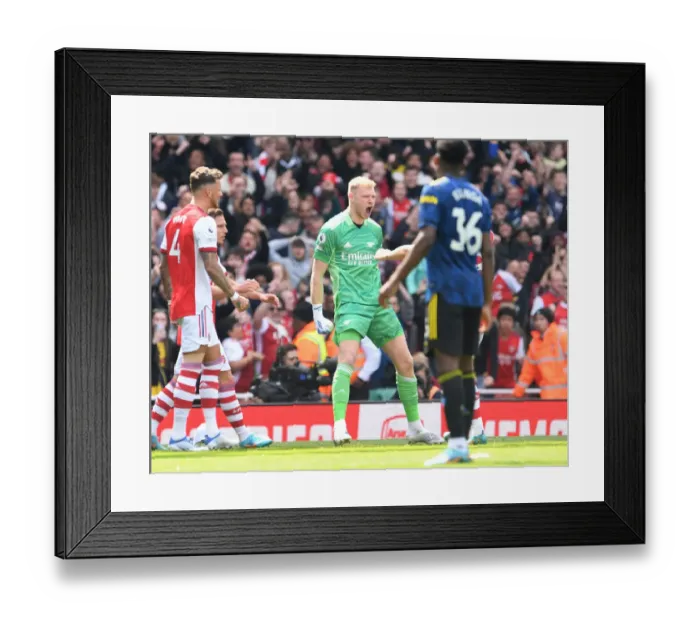 Framed Print : Arsenal Celebrate Manchester United Penalty Miss: Ramsdale's Heroic Moment in Arsenal vs. Manchester United (2021-22)