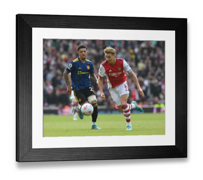 Framed Print : Clash of Talents: Arsenal's Martin Odegaard vs Manchester United's Jadon Sancho in the Premier League Showdown