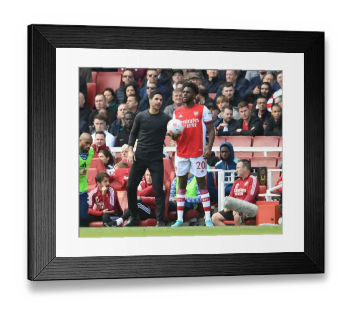 Framed Print : Arsenal's Mikel Arteta and Nuno Tavares Face Off Against Manchester United in Premier League Showdown