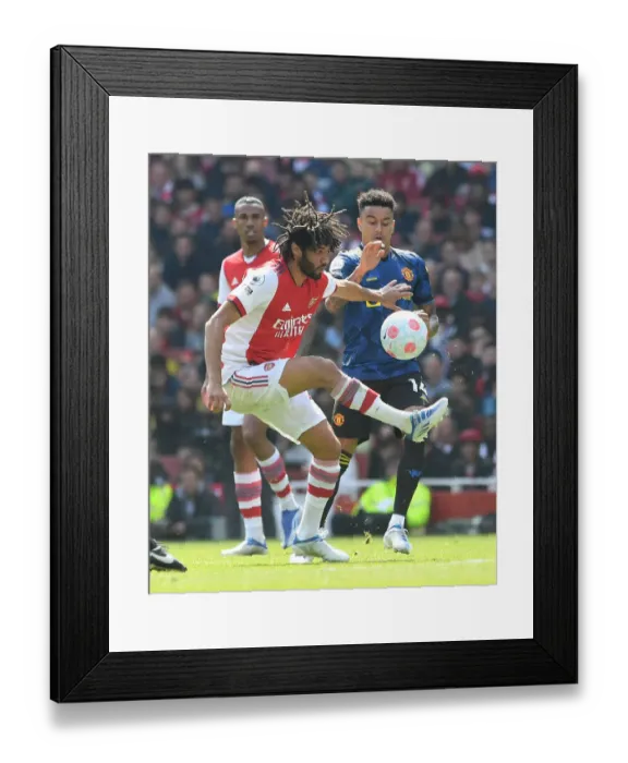Framed Print : Arsenal vs Manchester United: Elneny Fends Off Lingard in Intense Premier League Clash Framed Print : Arsenal vs Manchester United: Elneny Fends Off Lingard in Intense Premier League Clash