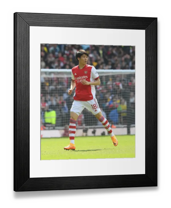 Framed Print : Arsenal's Tomiyasu in Action: Premier League Clash Against Manchester United at Emirates Stadium
