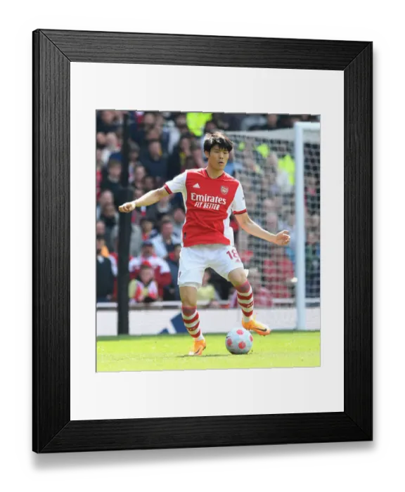 Framed Print : Arsenal's Tomiyasu in Action: Premier League Showdown against Manchester United at Emirates Stadium