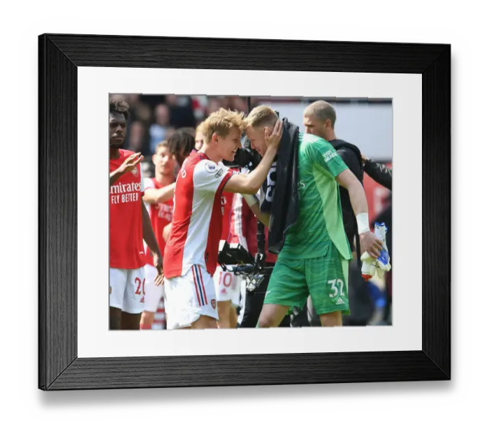 Framed Print : Arsenal's Victory: Ramsdale and Odegaard Celebrate Over Manchester United