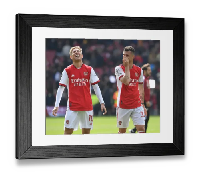 Framed Print : Arsenal's Smith Rowe and Xhaka Celebrate Victory Over Manchester United in 2021-22 Premier League Framed Print : Arsenal's Smith Rowe and Xhaka Celebrate Victory Over Manchester United in 2021-22 Premier League