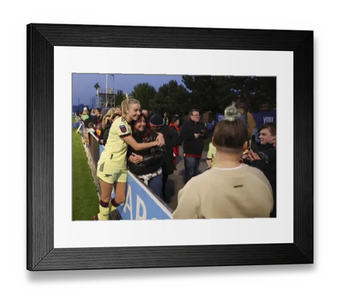 Framed Print : Arsenal's Leah Williamson Celebrates with Mother after Everton Victory (Everton Women vs Arsenal Women, FA WSL 2021-22)