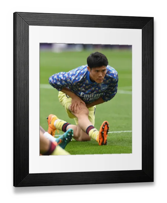 Framed Print : Arsenal's Tomiyasu Prepares for West Ham Showdown in Premier League