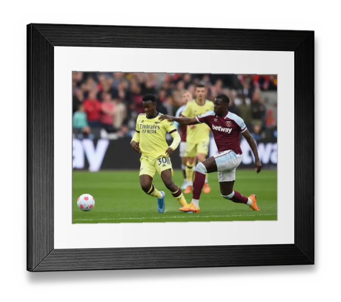 Framed Print : Arsenal's Eddie Nketiah Clashes with West Ham's Kurt Zouma in Premier League Showdown