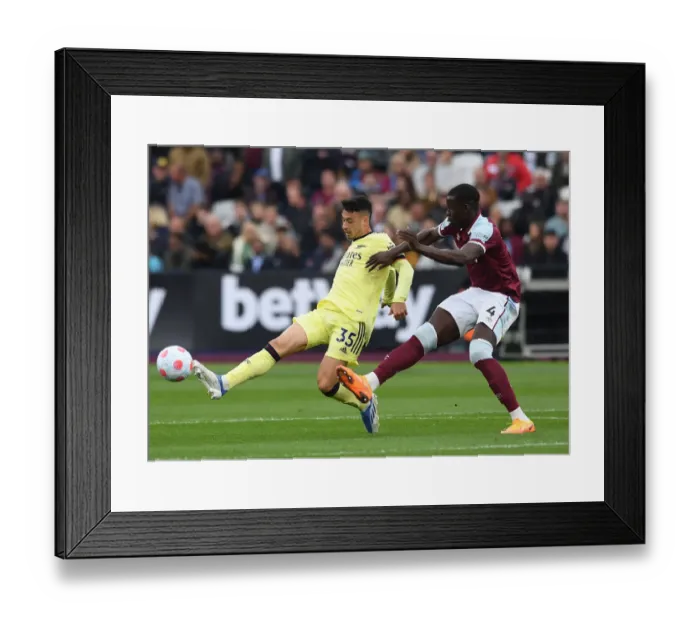Framed Print : Gabriel Martinelli Faces Kurt Zouma: Intense Battle at London Stadium - West Ham United vs Arsenal, Premier League 2021-22 Framed Print : Gabriel Martinelli Faces Kurt Zouma: Intense Battle at London Stadium - West Ham United vs Arsenal, Premier League 2021-22