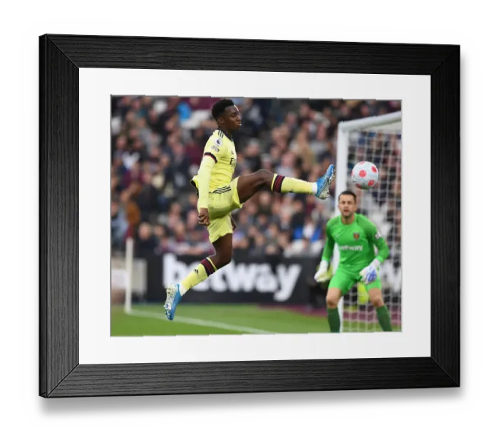 Framed Print : Arsenal's Eddie Nketiah Faces Off Against West Ham in Intense Premier League Showdown