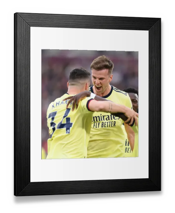 Framed Print : Rising High: Holding and Xhaka Celebrate Arsenal's Goal Against West Ham United (May 2022)