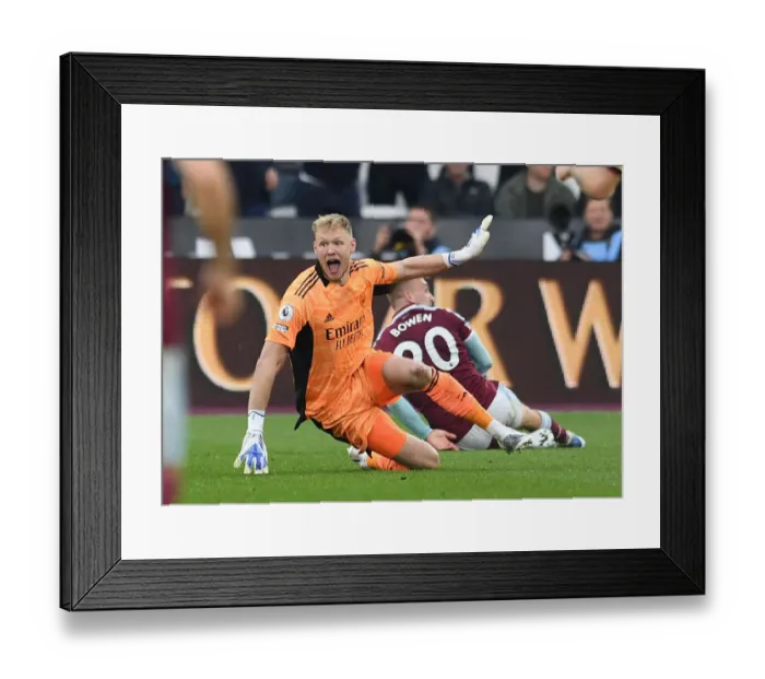 Framed Print : Arsenal's Ramsdale Reacts to Bowen Dive in Intense West Ham Clash (Premier League 2021-22)