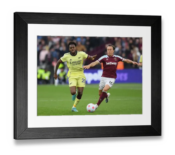 Framed Print : Nuno Tavares vs Mark Noble: Intense Battle in West Ham United vs Arsenal Premier League Clash Framed Print : Nuno Tavares vs Mark Noble: Intense Battle in West Ham United vs Arsenal Premier League Clash