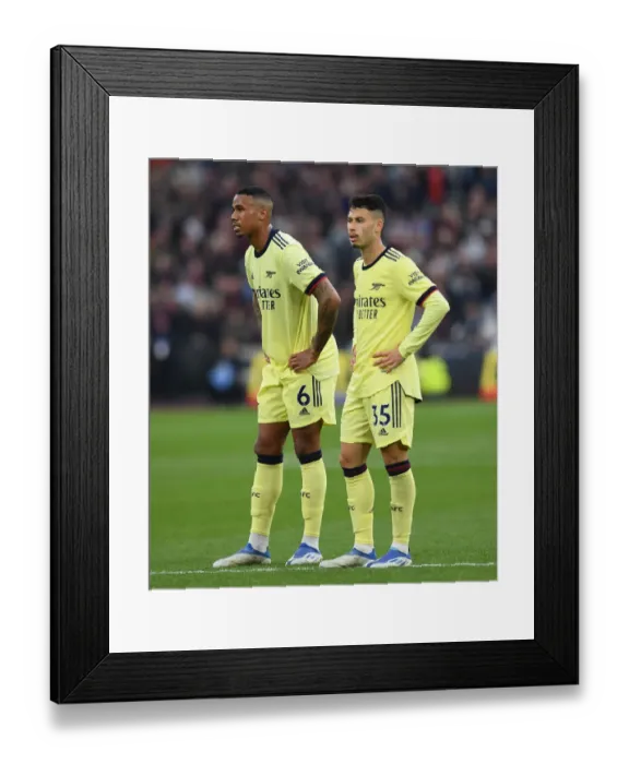 Framed Print : Arsenal's Magalhaes and Martinelli in Action against West Ham United - Premier League 2021-22